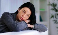 Lonely sad woman deep in thoughts